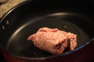 Heat olive oil in skillet on med-high heat.  Cook and brown 6oz of ground sausage.