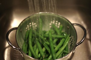 Rinse the green beans under cold water.