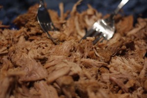 Place pork into dish and shred using two forks. 