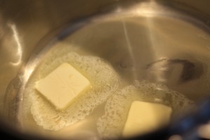 Start by working on the caramelized onions.  Melt 2 tablespoons of butter in a saucepan on medium heat.