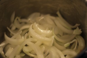 Add the sliced onions to the pan.  Cover and let cook down for about 10-15 minutes.  Stir occasionally.