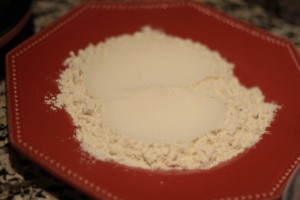 Create a dredging station.  Place the flour onto a plate. 