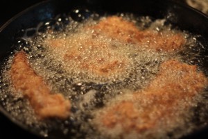 Fry chicken in batches (about 4-5 tenders at a time).  Fry for about 4-5 minutes per side.  The internal temperature of the chicken should be around 165 degrees Fahrenheit when cooked through.