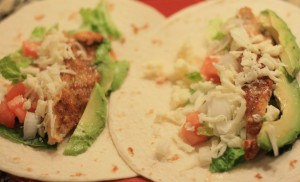 Layer ½ fish filet and some of the vegetables onto each tortilla.  Sprinkle with fresh shredded mozzarella.