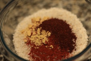Combine the breadcrumbs, panko, salt, pepper, garlic powder, paprika, ground mustard, and chili powder.  Stir the ingredients.  Place breadcrumb mixture onto a plate. 