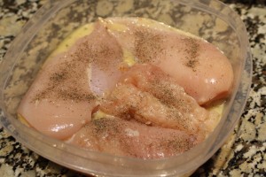 Place the chicken breasts into marinating bowl in a single layer. 