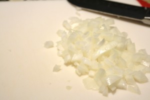 Prepare your other ingredients, such as chopping the onion, chopping/grinding the pepperoni, and shredding the cheeses.   