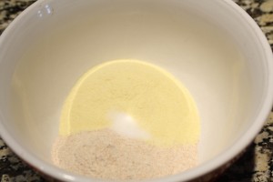 Start out by combining the whole wheat flour, semolina flour, and salt.  Whisk together in a large mixing bowl.