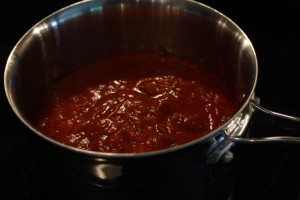 In a 3qt saucepan, combine the crushed tomatoes and spaghetti sauce.  Stir to combine.