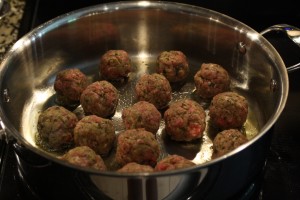 Add the meatballs to the skillet to brown. 