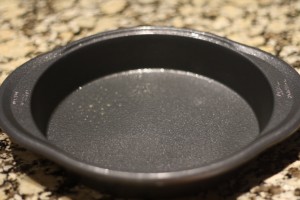 Preheat the oven to 375 degrees Fahrenheit.  Spray an 8 inch x 1.5 inch round cake pan with cooking spray. 