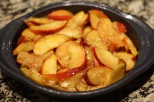 Pour the peach filling into the prepared cake pan.