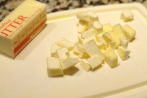 Cut the 3 tbsp of unsalted butter into small cubes.  Add the cubes to the topping mixture.