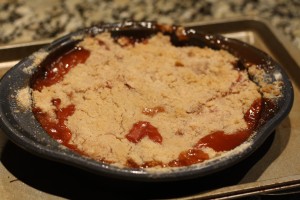 Remove the crisp from the oven and allow to cool and rest for 20-30 minutes.  The crisp will be extremely hot when coming out of the oven, so use extreme caution.  Make sure you allow the crisp to cool before serving/eating.  (Notice the filling bubbled over…glad I put that baking sheet underneath!) 