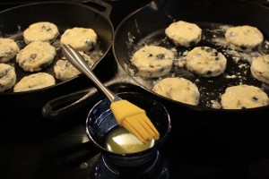 Brush the tops of the biscuits with the 2 tbsp of melted butter.