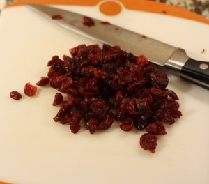 Chop the dried cranberries. 