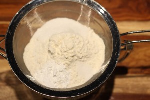 Sift together the dry ingredients:  The 2 and ½ cups flour, baking powder, salt, and sugar.
