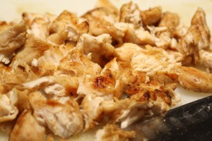 Once the chicken is cooked and cool enough to handle, cut the chicken into bite sized pieces and set aside. 