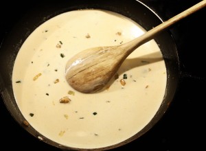 Next, add in the heavy cream and milk.  Bring to a simmer, stirring every few minutes.  The sauce will start to thicken after about 5- 10 minutes.  