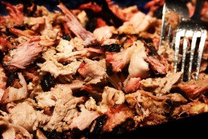 Remove pork shoulder from grill/smoker once the internal temperature of 190 degrees Fahrenheit is reached.  Tent the pork roast with foil and allow to rest for 30 minutes to 1 hour. Shred the pork by pulling with 2 forks. Discard any fatty/tough tissue.