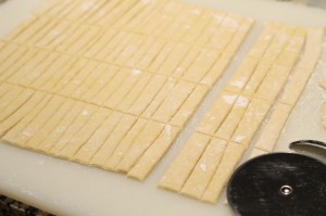 Using a pizza cutter, cut out noodles to desired length and size. 