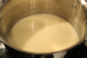 Whisk in the broth/wine mixture and the warmed heavy cream.  Bring to a low simmer.  The liquids will begin to thicken.  This will take about 5-10 minutes after it starts to simmer.