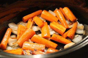 Transfer the carrots to the slow cooker using a spoon or tongs.