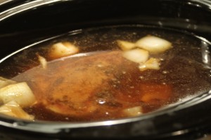 Add the liquids to the slow cooker:  Beef broth, beer, water, Worcestershire sauce, and mustard.