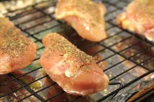 Place the chicken on a baking rack on a baking sheet.  