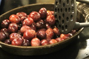 Remove the grapes and chicken.  Allow the chicken to rest.  Smash the grapes just slightly with a potato masher to release some of their juices.