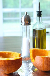 Drizzle the inside with 1 tsp olive oil per half of pumpkin, and season with salt.