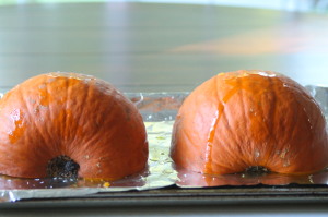 Place the pumpkin halves on a baking sheet lined with foil, flesh side down.