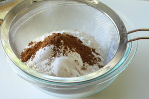 In a separate bowl, sift together the 2 and ½ cups flour, 1 and ½ tsp baking soda, 1 and ½ tsp baking powder, 1 and ½ tsp pumpkin pie spice, and 1 tsp salt.