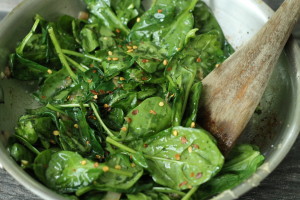 Add seasonings to spinach