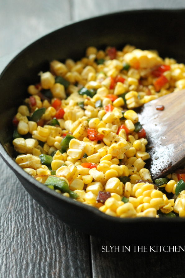 Add corn to peppers